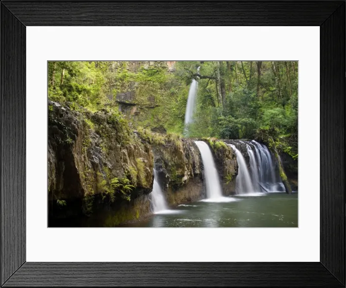 Framed Print : Nandroya Falls - beautiful two-tiered waterfall located in lush tropical rainforest. Water cascades down in two steps, first in a hugh pool and then furtheron down a stream - Wooroonooran National Park, Wet Tropics World Heritage Area, Queensland Framed Print : Nandroya Falls - beautiful two-tiered waterfall located in lush tropical rainforest. Water cascades down in two steps, first in a hugh pool and then furtheron down a stream - Wooroonooran National Park, Wet Tropics World Heritage Area, Queensland