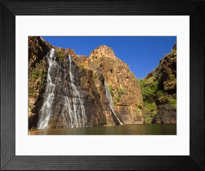 Framed Print : Twin Falls - water cascades down a steep cliff into a turquoise cloured pool which is surrounded by high, red cliffs - Kakadu National Park, Northern Territory, Australia Framed Print : Twin Falls - water cascades down a steep cliff into a turquoise cloured pool which is surrounded by high, red cliffs - Kakadu National Park, Northern Territory, Australia