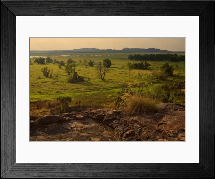 Framed Print : Ubirr view - breathtaking view from Ubirr rock towards the Nardab floodplain. The evening sun is partly hidden behind beautiful clouds and sends sunrays through the open gaps between the clouds Framed Print : Ubirr view - breathtaking view from Ubirr rock towards the Nardab floodplain. The evening sun is partly hidden behind beautiful clouds and sends sunrays through the open gaps between the clouds