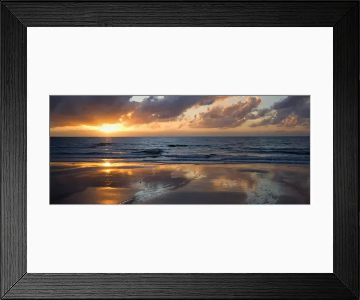 Framed Print : Tropical sunrise - the sun rises above the ocean at a tropical beach in North Queensland. The sun is partly hidden behind clouds and paints beautiful pastel colours, ranging from yellow to pink, in the sky Framed Print : Tropical sunrise - the sun rises above the ocean at a tropical beach in North Queensland. The sun is partly hidden behind clouds and paints beautiful pastel colours, ranging from yellow to pink, in the sky