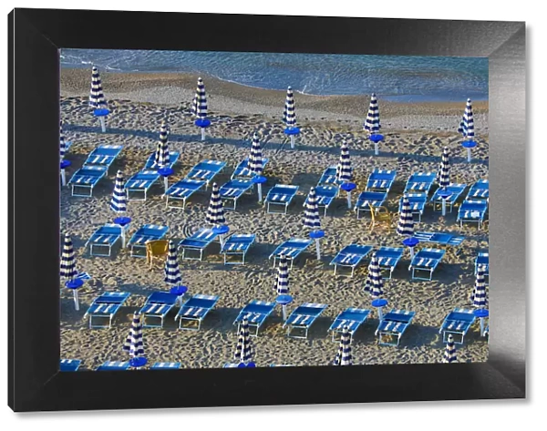 13132525. Beach chairs and umbrellas on the beach at Vietri Sul Mare