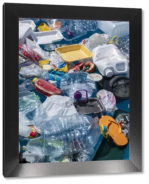 13132605. Plastic garbage floating in the ocean