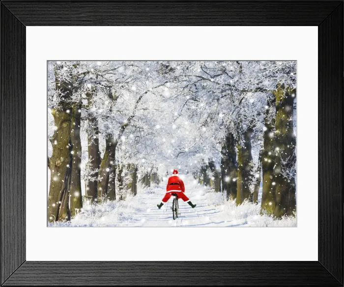 Framed Print : 13132616. Father Christmas riding bicycle through Oak trees covered in snow in winter Date Framed Print : 13132616. Father Christmas riding bicycle through Oak trees covered in snow in winter Date