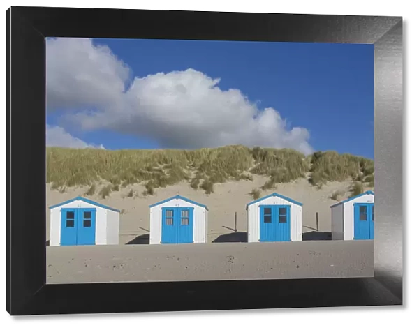 13132644. Colourful huts at the beach - island of Texel - Netherlands Date