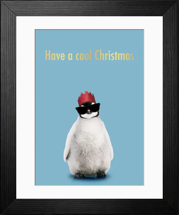 Framed Print : 13132698. Emperor Penguin, Young smiling with Christmas party hat and sunglasses Date