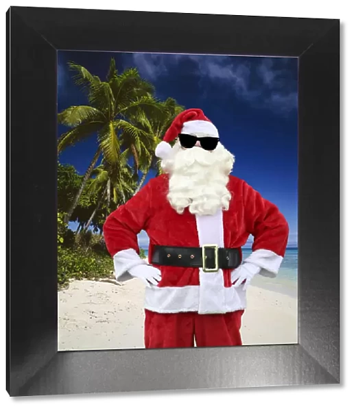 JLR-332-M. Father Christmas, on the beach with palm trees wearing sunglasses Date
