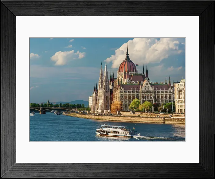 Framed Print : Tour boat passes Hungary's Parliament, built between 1884-1902 is the country's largest building. It has 691 rooms and sits next to the Danube River, Budapest, Hungary. Date: 27-06-2007