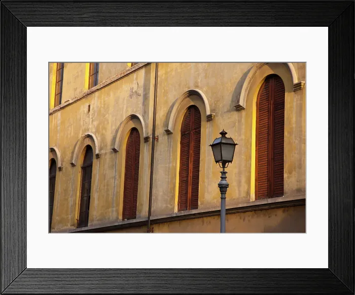Framed Print : Italy, Tuscany, Lucca. Street lamppost and arched windows with wooden shutters. Date: 10-10-2010 Framed Print : Italy, Tuscany, Lucca. Street lamppost and arched windows with wooden shutters. Date: 10-10-2010