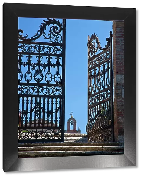 Italy, Tuscany, Montepulciano. The wrought iron gate leading to the cemetery near the Church of San Biaggio. Date: 20-09-2010