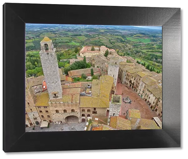 Italy, Tuscany, San Gimignano. View from the Torre Grossa over the rooftops of San Gimignano and the Tuscan countryside, Tuscany, Italy Date: 07-11-2016