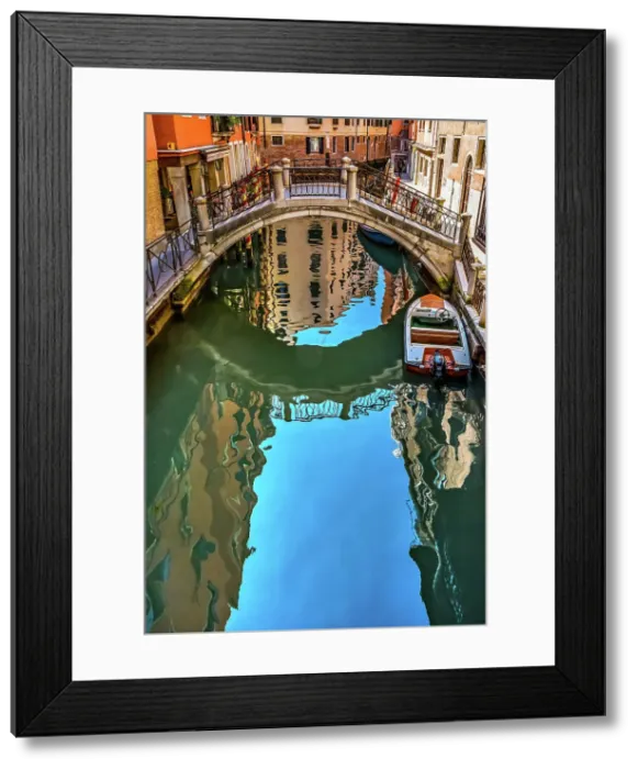 Framed Print : Colorful small canal and bridge creates beautiful reflections in Venice, Italy Date: 26-01-2021 Framed Print : Colorful small canal and bridge creates beautiful reflections in Venice, Italy Date: 26-01-2021
