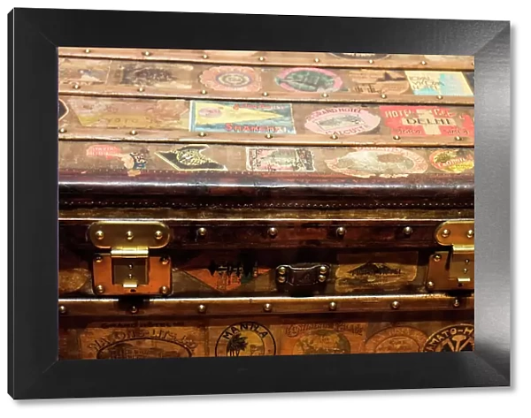 Old steamer trunk covered with stickers of various destinations. Date: 15-12-2017
