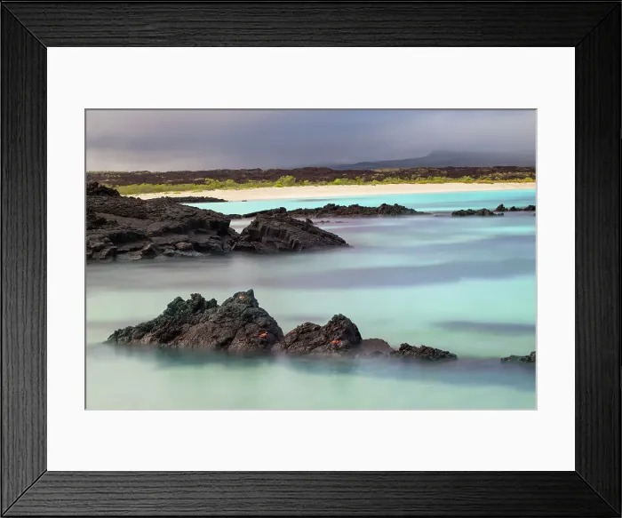 Framed Print : Lava rocks along tranquil shoreline of San Cristobal Island, Galapagos, Ecuador. Date: 29-07-2021 Framed Print : Lava rocks along tranquil shoreline of San Cristobal Island, Galapagos, Ecuador. Date: 29-07-2021