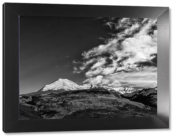 USA, Utah. View of the snow covered Manti-La Sal Mountains in late autumn with clouds, near Moab. Date: 01-11-2020