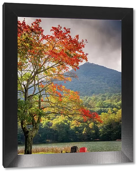 Colorful chairs on the banks of the lake, Peaks Of Otter, Blue Ridge Parkway, Smoky Mountains, USA. Date: 05-10-2018