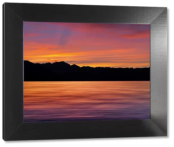 USA, Washington State, Seabeck. Composite panoramic sunset over Hood Canal. Date: 10-08-2021