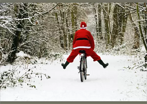 Father Christmas - on a bicycle, freewheeling