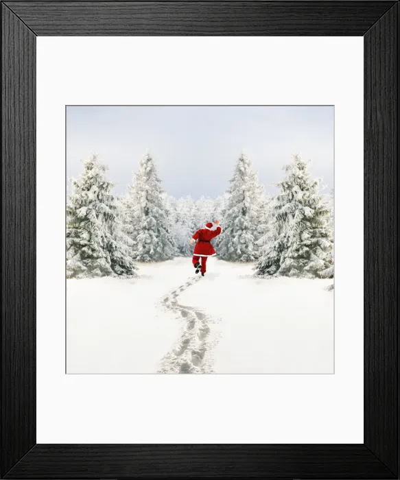 Framed Print : Snow - Father Christmas making footprints in winter landscape with conifers Framed Print : Snow - Father Christmas making footprints in winter landscape with conifers