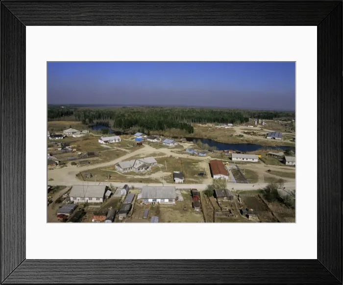 Framed Print : Maloyuganskii village, aerial view over the village and taiga-forest, a fog visible over horizon due to uncontrolled forest fires; a typical siberian village on a small river - a tributary of river Bolshoi Ugan, near Surgut, Siberia Framed Print : Maloyuganskii village, aerial view over the village and taiga-forest, a fog visible over horizon due to uncontrolled forest fires; a typical siberian village on a small river - a tributary of river Bolshoi Ugan, near Surgut, Siberia