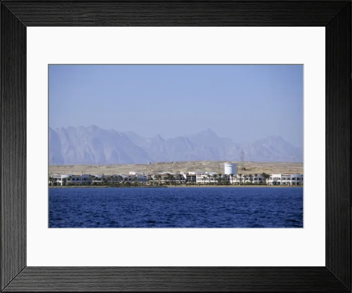 Framed Print : Egypt - Red Sea shore near Hurghada town with a distant view into Arabian desert, built over with cheap and medium quality resorts for many kilometers; January Eg39. 0345 Framed Print : Egypt - Red Sea shore near Hurghada town with a distant view into Arabian desert, built over with cheap and medium quality resorts for many kilometers; January Eg39. 0345