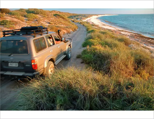 Western Australia - well-equipped 4WD vehicle driving over rough track towards the beach at Warroora Station, Ningaloo Reef Marine Park, Western Australia. No PR LSP00141