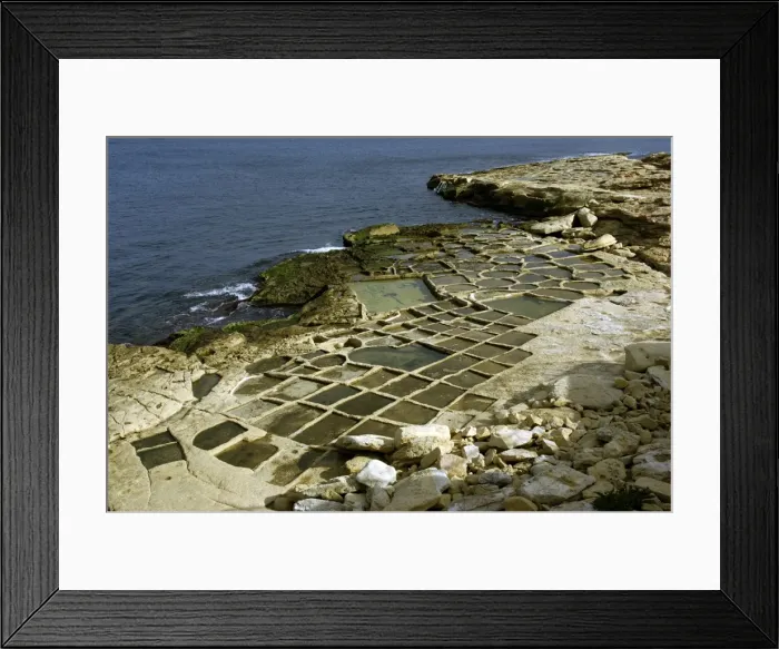 Framed Print : Salt pans at Marsaskala, Malta. Look like shallow trays cut into the stone. They were created by the Knights in the 17th century. There are a number of salt pan sites around the Island although most are disused - the site in this picture Framed Print : Salt pans at Marsaskala, Malta. Look like shallow trays cut into the stone. They were created by the Knights in the 17th century. There are a number of salt pan sites around the Island although most are disused - the site in this picture