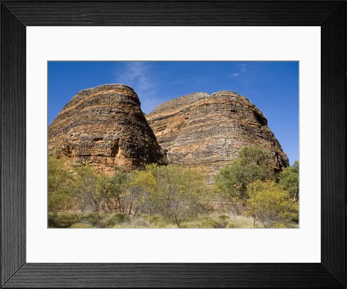 Framed Print : Bungle Bungle rock formations. These sandstone and conglomerate beehive-like towers were formed through water erosion 350 million years ago. The have unique black and orange bands Framed Print : Bungle Bungle rock formations. These sandstone and conglomerate beehive-like towers were formed through water erosion 350 million years ago. The have unique black and orange bands