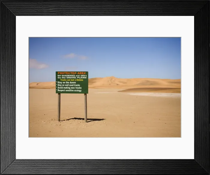 Framed Print : Conservation board at the begging of the Dune Sea - -Dune Fields - Namib Desert - Namibia - Africa Framed Print : Conservation board at the begging of the Dune Sea - -Dune Fields - Namib Desert - Namibia - Africa