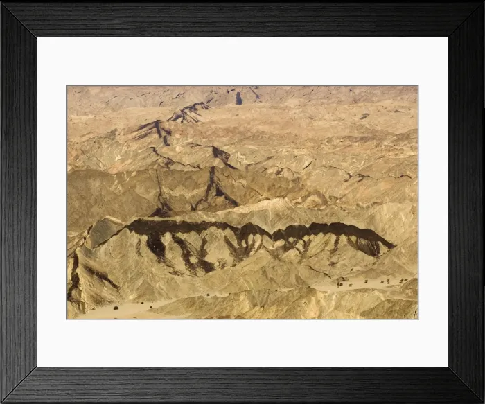 Framed Print : Black dolerite dykes clearly visible as they cut through the rocky terrain of the Moon Valley near Swakopmund - Namib Desert - Namibia - Africa