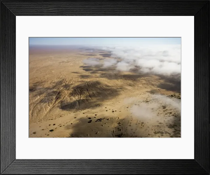Framed Print : Aerial view of mist rolling in from the cold Atlantic Ocean over the Namib Desert Plains - Namib Desert - Namibia - Africa Framed Print : Aerial view of mist rolling in from the cold Atlantic Ocean over the Namib Desert Plains - Namib Desert - Namibia - Africa