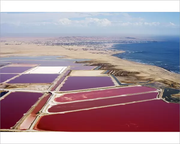Evaporation ponds for the commercial extraction of sea salt - showing the bright resulting colours - Near Swakopmund - Namib Deser - Atlantic Coast - Namibia - Africa