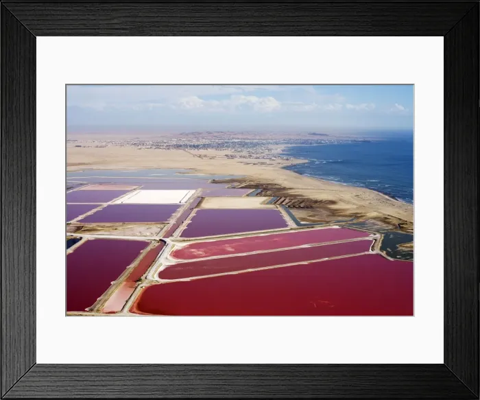 Framed Print : Evaporation ponds for the commercial extraction of sea salt - showing the bright resulting colours - Near Swakopmund - Namib Deser - Atlantic Coast - Namibia - Africa Framed Print : Evaporation ponds for the commercial extraction of sea salt - showing the bright resulting colours - Near Swakopmund - Namib Deser - Atlantic Coast - Namibia - Africa