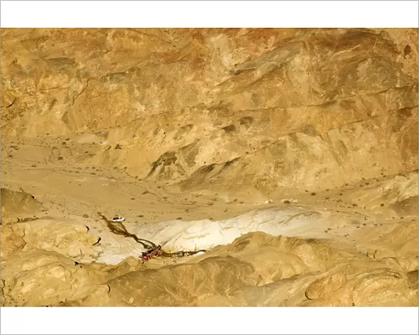 Uranium Prospecting taking place in the Moon Valley - The white patches are residue from the drilling process - Namib Desert - Namibia - Africa