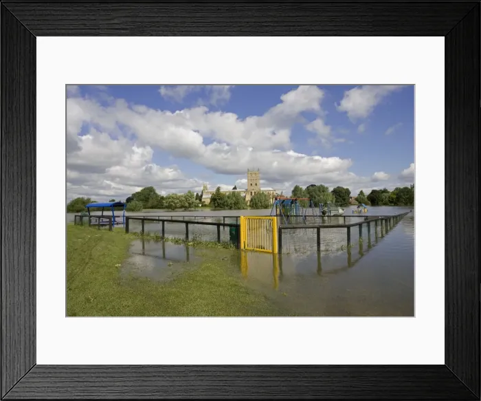 Framed Print : Flooded childrens playground with Tewkesbury Abbey inundated by unprecedented flooding of the Rivers Severn and Avon July 2007 Gloucestershire UK Framed Print : Flooded childrens playground with Tewkesbury Abbey inundated by unprecedented flooding of the Rivers Severn and Avon July 2007 Gloucestershire UK