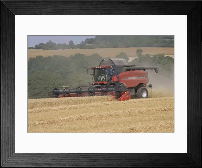 Framed Print : Red combine harvester working in Cotswolds near Winchcombe, UK Framed Print : Red combine harvester working in Cotswolds near Winchcombe, UK