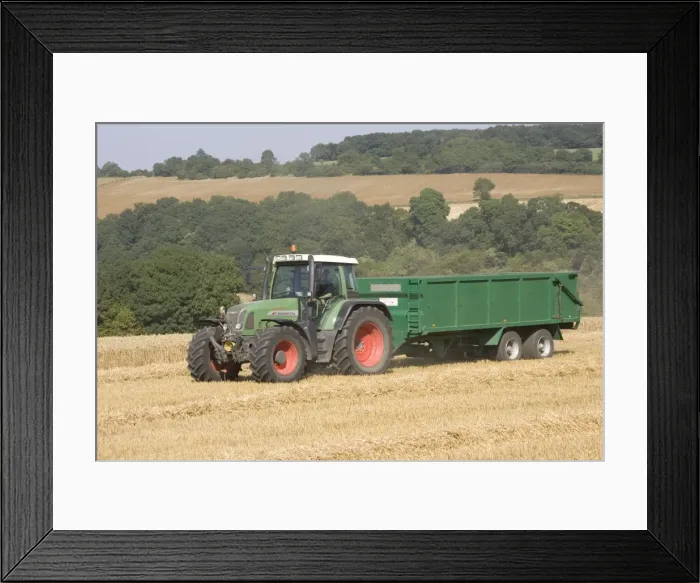 Framed Print : Tractor hauling wheat from combine harvester, Cotswolds near Winchcombe, UK Framed Print : Tractor hauling wheat from combine harvester, Cotswolds near Winchcombe, UK