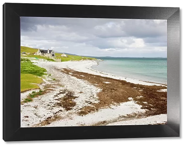 Sandy beach and croft on Berneray (Bearnaraigh), with the Sound of Harris beyond; Outer Hebrides, Scotland