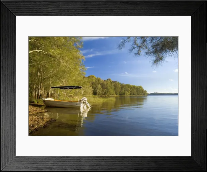 Framed Print : Boating idyll - small motorboat anchors in a tranquil bay at the Myall Lakes. Late afternoon - Myall Lakes National Park, New South Wales, Australia Framed Print : Boating idyll - small motorboat anchors in a tranquil bay at the Myall Lakes. Late afternoon - Myall Lakes National Park, New South Wales, Australia