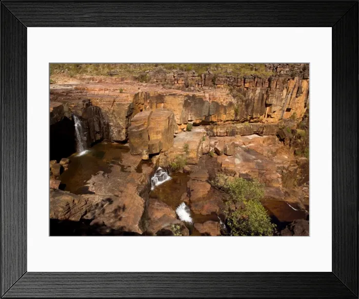Framed Print : Twin Falls Plateau - water cascades over red rocks and cliffs on Twin Falls Plateau which is high up on top of Twin Falls - Kakadu National Park, Northern Territory, Australia Framed Print : Twin Falls Plateau - water cascades over red rocks and cliffs on Twin Falls Plateau which is high up on top of Twin Falls - Kakadu National Park, Northern Territory, Australia
