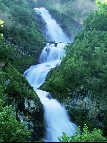 Gross Glockner National Park - mountain stream & cascading waterfall - in Gross Glockner National Park, Austrian Alps, Austria