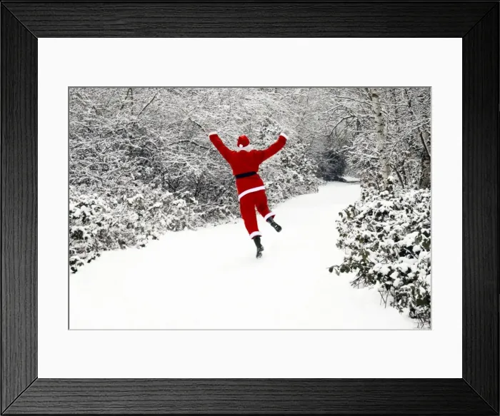 Framed Print : Father Christmas - in snow covered avenue Framed Print : Father Christmas - in snow covered avenue
