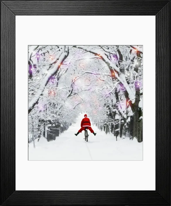 Framed Print : Father Christmas riding through avenue in winter snow with Christmas lights. Digital Manipulation: Father Christmas & lights