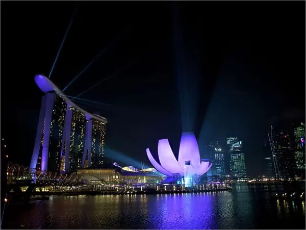 Singapore - Marine Bay sands and art science museum (right) night laser show