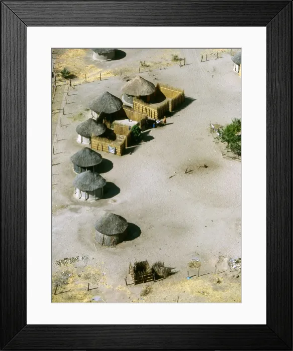 Framed Print : Aerial view of thatched rondavels made of mud and straw in a typical African village. Maun, Botswana Framed Print : Aerial view of thatched rondavels made of mud and straw in a typical African village. Maun, Botswana