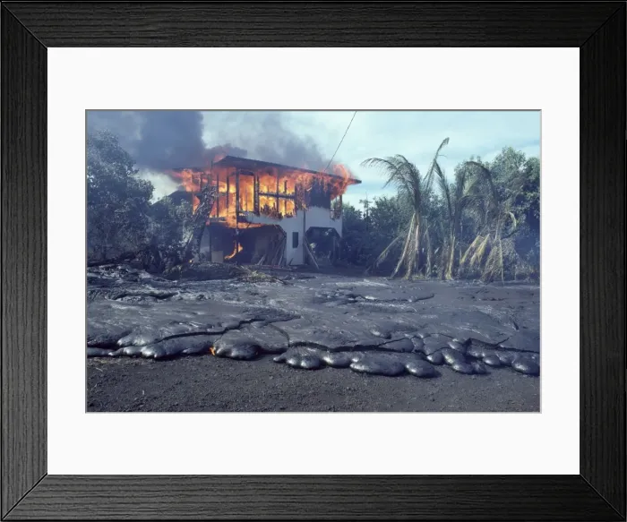 Framed Print : USA - Hawaii - Big Island - Eruption of the Pu'u O'o Vent - a vent of the Kilauea Volcano - in the village of Kalapana Gardens a house surrounded by lava erupts in flames Framed Print : USA - Hawaii - Big Island - Eruption of the Pu'u O'o Vent - a vent of the Kilauea Volcano - in the village of Kalapana Gardens a house surrounded by lava erupts in flames