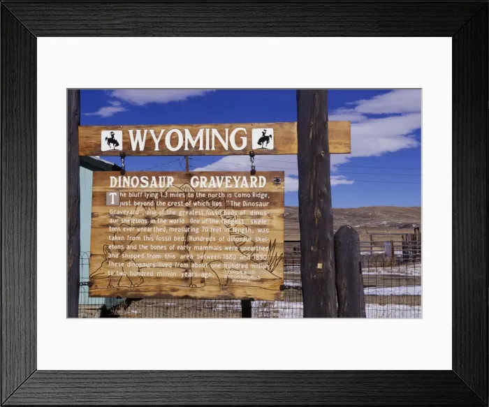 Framed Print : Dinosaur sites: Como Bluff, Wyoming, USA A sign near Medicine Bow, north-west of Laramie, Wyoming, brings attention to the historical importance of the ridge seen in the background. In the late Nineteenth Century Framed Print : Dinosaur sites: Como Bluff, Wyoming, USA A sign near Medicine Bow, north-west of Laramie, Wyoming, brings attention to the historical importance of the ridge seen in the background. In the late Nineteenth Century