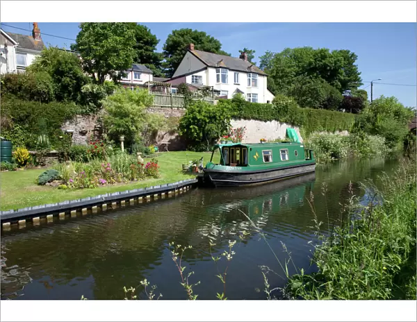 Green Canal Barge - moored on Grand Western Union Canal near Taunton Somerset UK