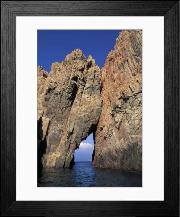 Framed Print : Pink Granite rock formation and tunnel over the sea - Corsica Framed Print : Pink Granite rock formation and tunnel over the sea - Corsica