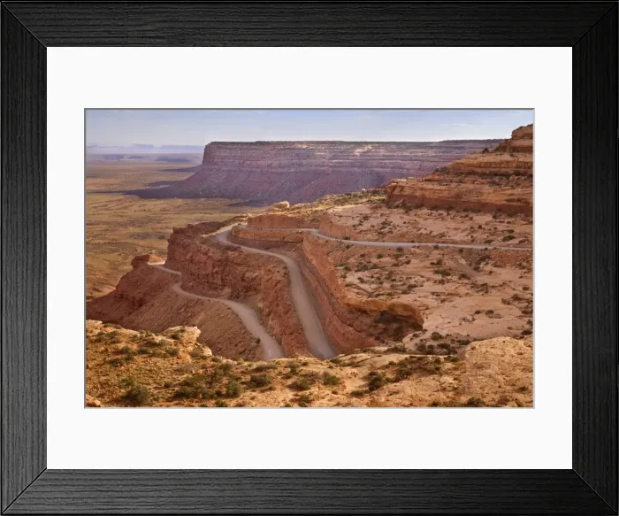Framed Print : Mokey Dugway - view onto the switchbacks of gravel road UT261, carved into the flanks of the cliff. UT 261 is descending the plateau of Cedar Mesa, view from a place called Mokey Dugway - Cedar Mesa, Utah, USA Framed Print : Mokey Dugway - view onto the switchbacks of gravel road UT261, carved into the flanks of the cliff. UT 261 is descending the plateau of Cedar Mesa, view from a place called Mokey Dugway - Cedar Mesa, Utah, USA