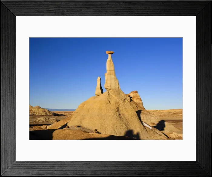 Framed Print : Tall Hoodoo - eroded clay sculptures with rocks balanced on their tops located amidst badlands - Bisti Badlands Wilderness Area - New Mexico - USA Framed Print : Tall Hoodoo - eroded clay sculptures with rocks balanced on their tops located amidst badlands - Bisti Badlands Wilderness Area - New Mexico - USA